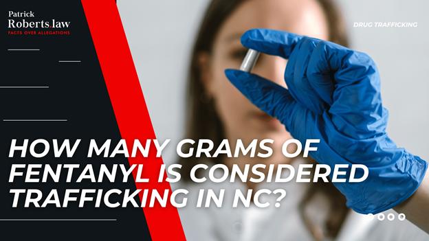 Lawyer-themed banner showing a gloved hand holding a vial of fentanyl with overlay text asking how many grams qualify as trafficking in North Carolina.